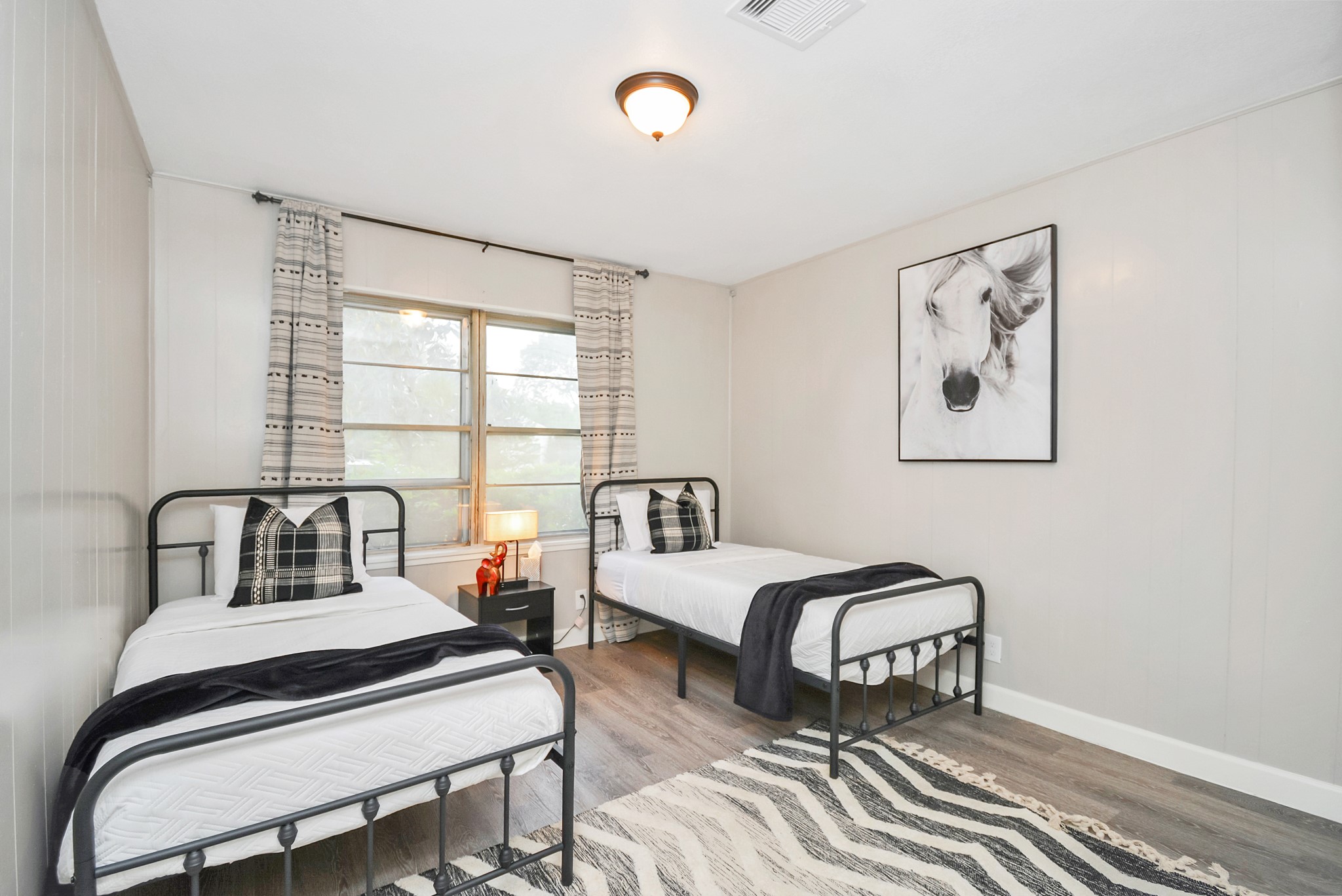 4710 Paradise Lane Houston, TX 77048 - Photo 24 of 42 a bedroom with furniture and a window