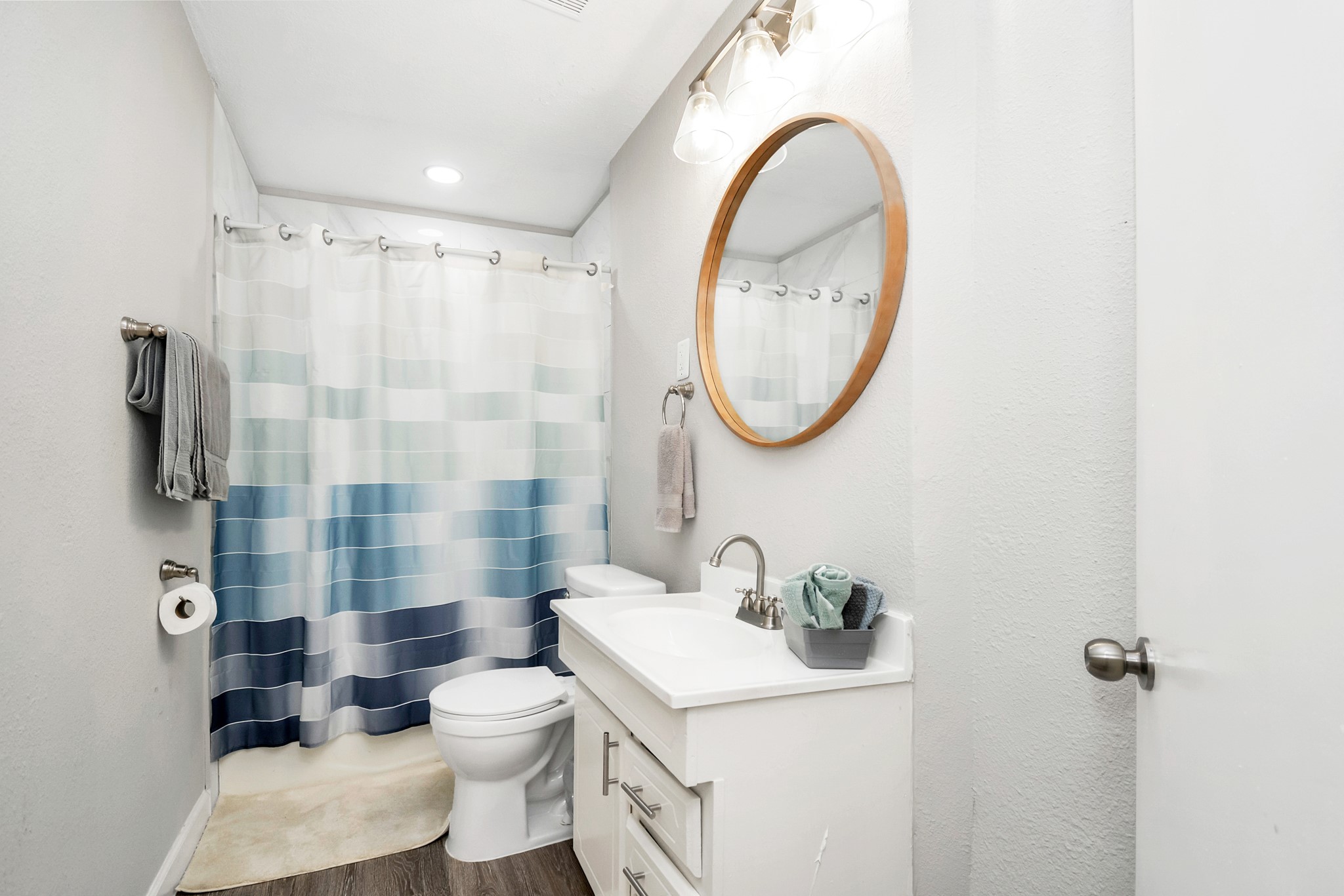 4710 Paradise Lane Houston, TX 77048 - Photo 37 of 42 a bathroom with a sink a toilet and a mirror
