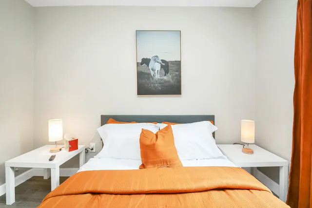 a bedroom with a bed and a chair