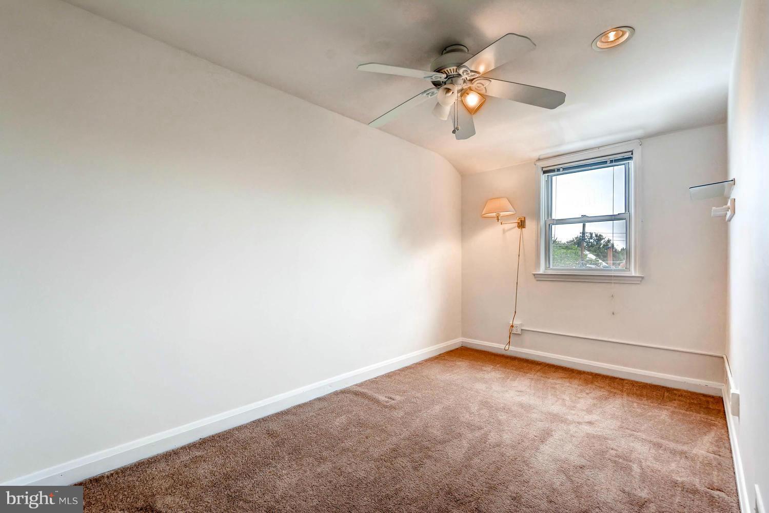 8325 Byington Road Baltimore, MD 21286 - Photo 17 of 28 an empty room with fan and windows