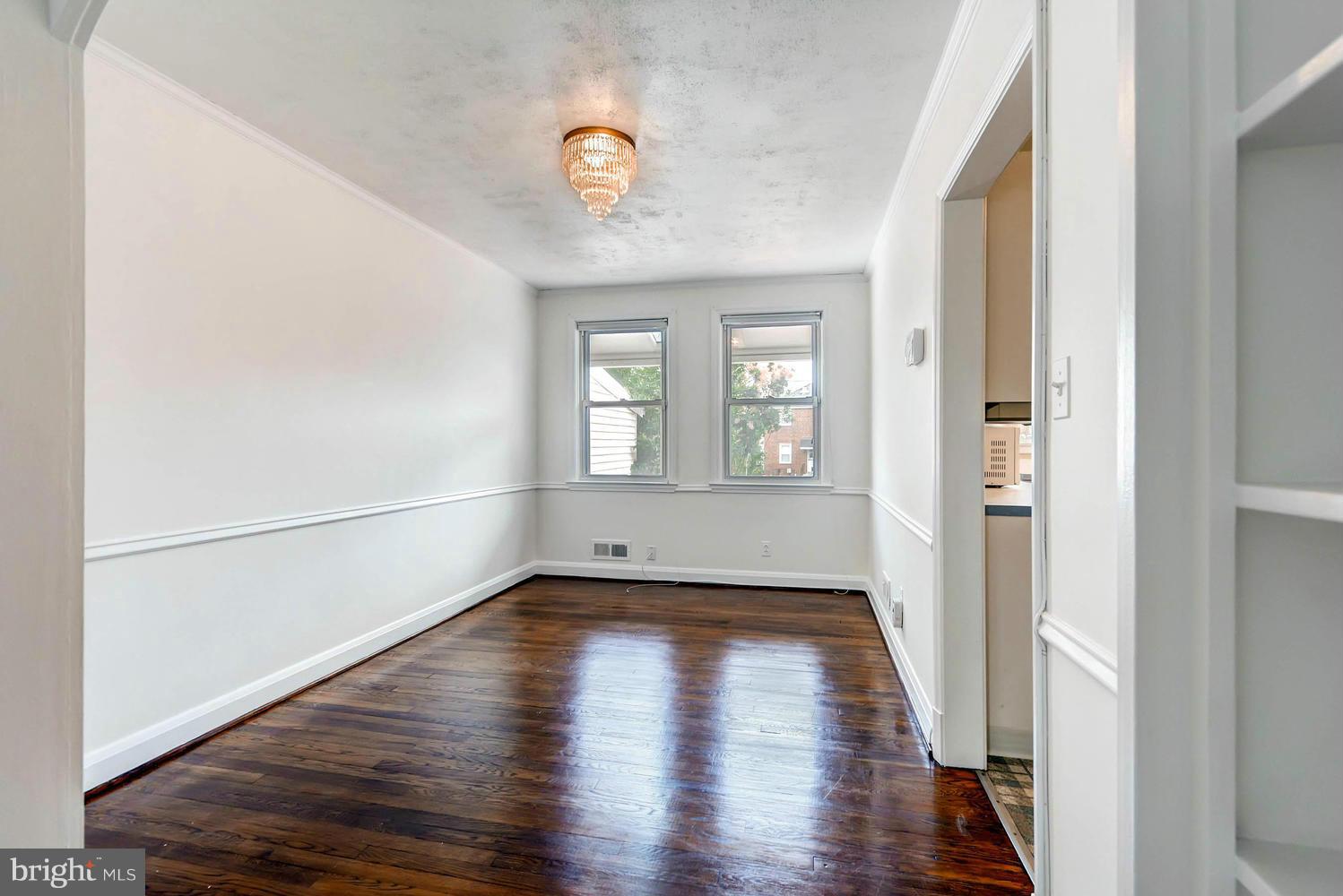 8325 Byington Road Baltimore, MD 21286 - Photo 9 of 28 a view of a room with wooden floor and entryway