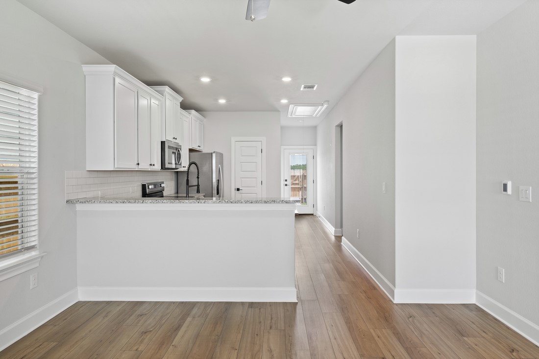 9316 Gladsome Path Manor, TX 78653 - Photo 5 of 18 a view of kitchen with wooden floor