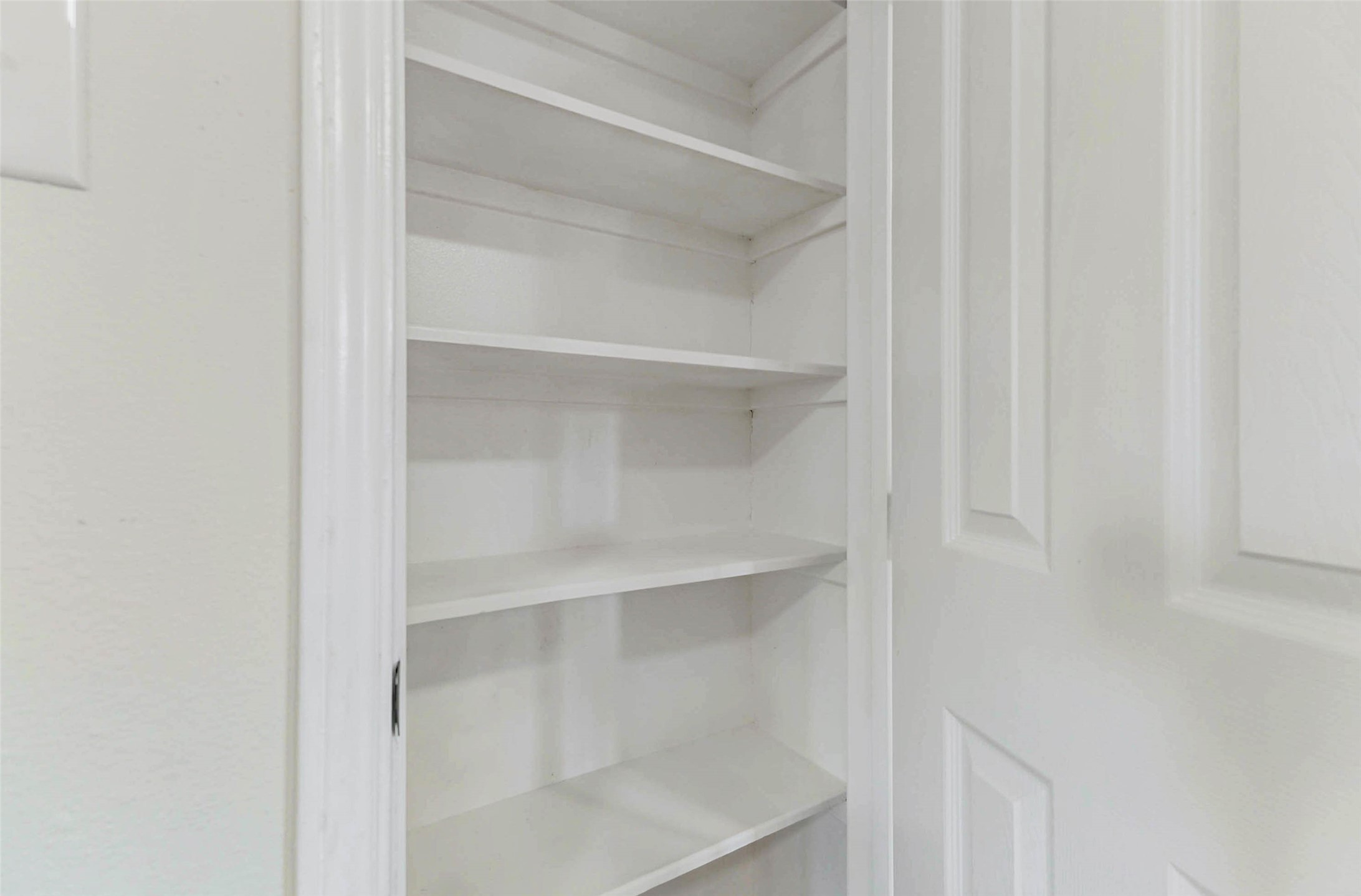 10102 Wiggins Street Houston, TX 77029 - Photo 22 of 26 a view of walk in closet with empty racks