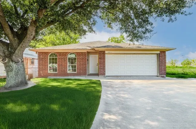 front view of a house with a yard