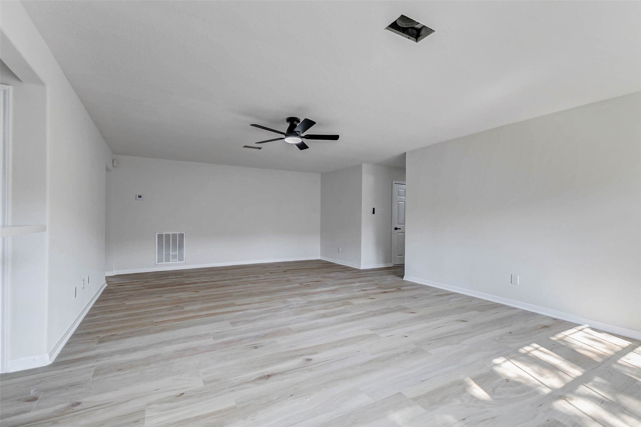 10102 Wiggins Street Houston, TX 77029 - Photo 8 of 26 wooden floor in an empty room