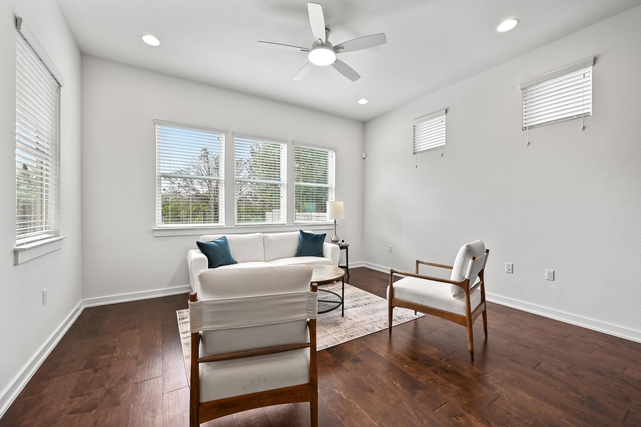 8901 Parker Ranch Circle, Unit A Austin, TX 78748 - Photo 7 of 31 Rich hardwood floors and numerous windows illuminate this versatile living space.