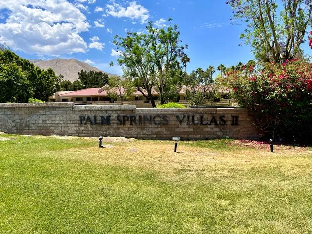 a room with furniture a rug and a window