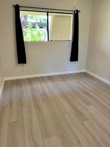 a bathroom with a toilet and a bathtub