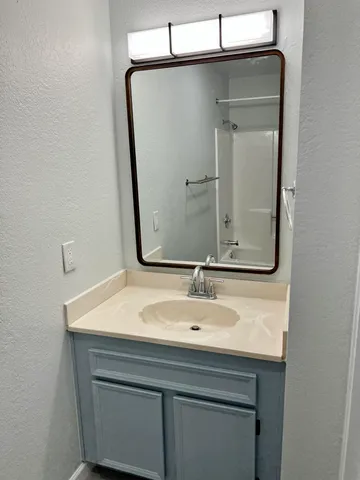 a view of a swimming pool with lounge chair