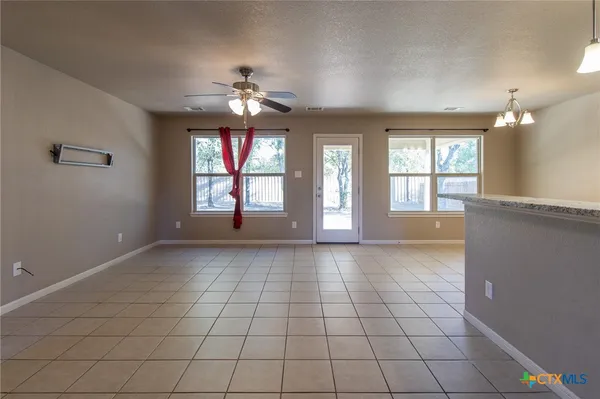 a kitchen with stainless steel appliances granite countertop a stove and a sink with granite countertops