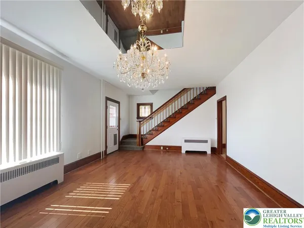 a view of entryway with wooden floor