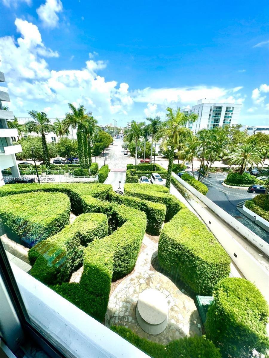 1100 West Avenue, Unit 425 Miami Beach, FL 33139 - Photo 14 of 17 a view of a garden with lawn chairs
