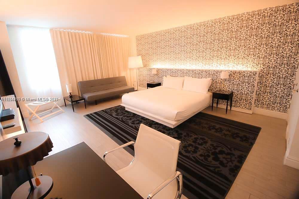 1100 West Avenue, Unit 425 Miami Beach, FL 33139 - Photo 7 of 17 view of living room with furniture and a rug