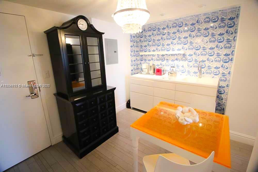 1100 West Avenue, Unit 425 Miami Beach, FL 33139 - Photo 8 of 17 view of living room with wooden floor