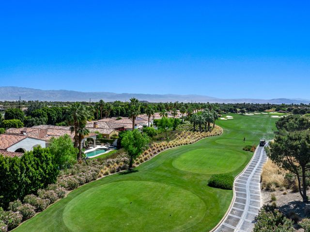 a view of a city street and ocean view