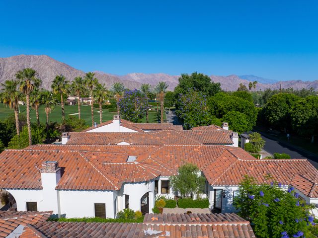 aerial view of a house with a yard
