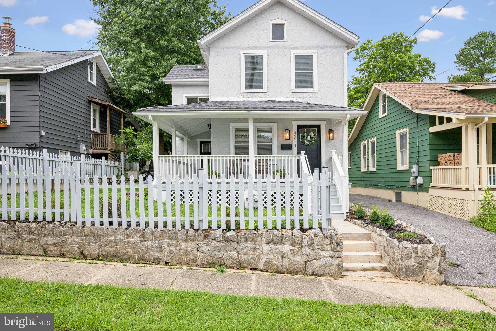 4014 37th Street Mount Rainier, MD 20712 - Photo 1 of 26 a front view of a house with a small garden