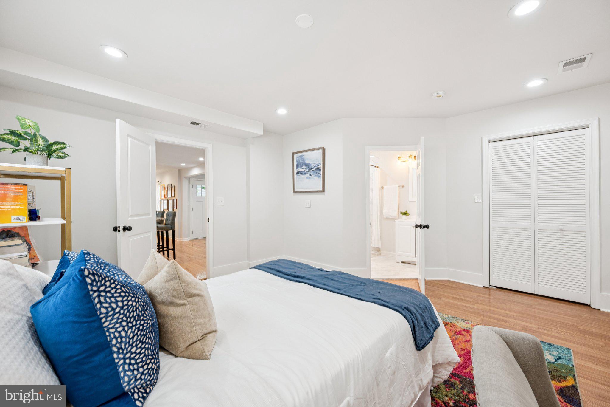 4014 37th Street Mount Rainier, MD 20712 - Photo 13 of 26 a bedroom with a bed and a couch