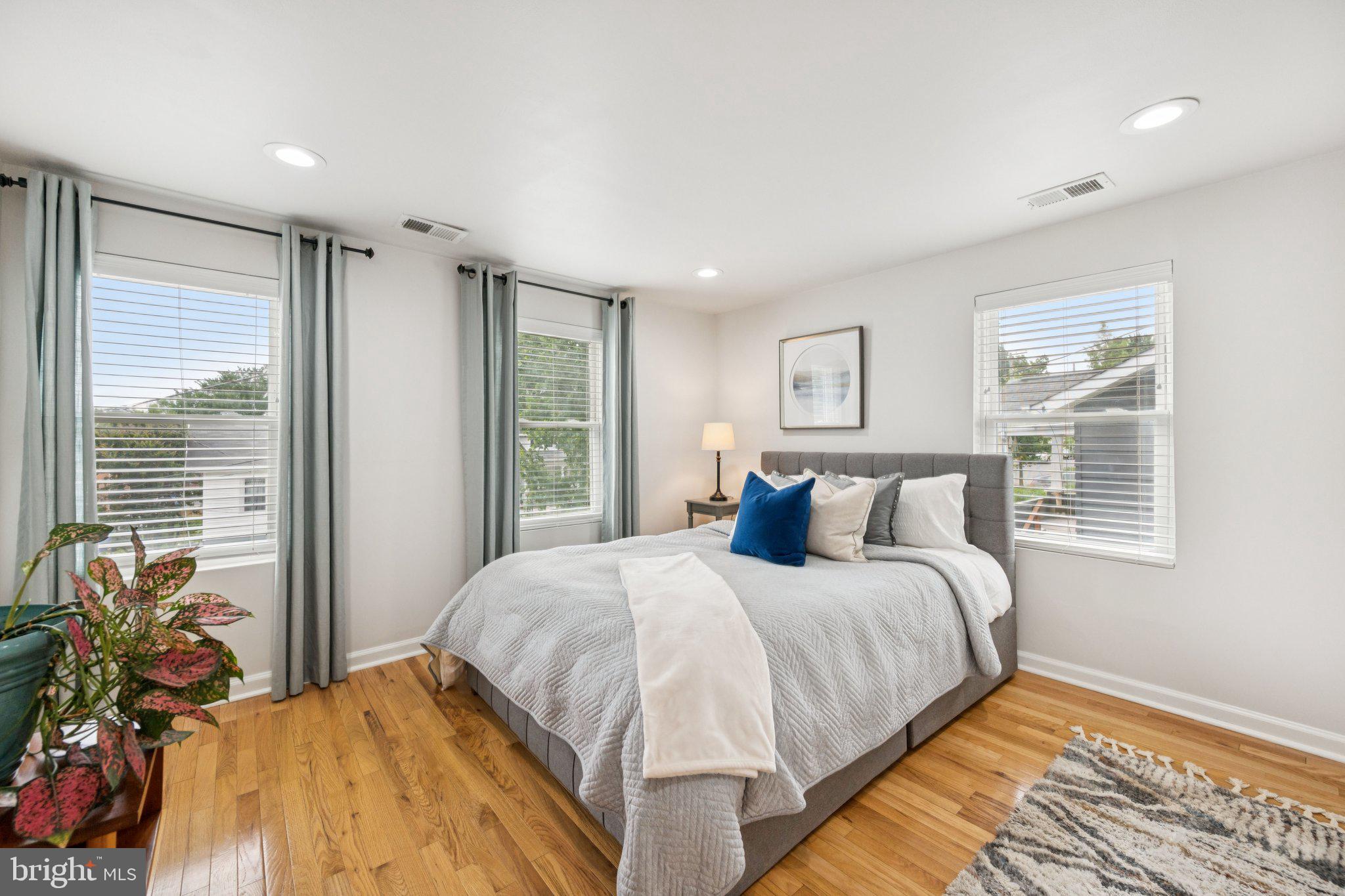 4014 37th Street Mount Rainier, MD 20712 - Photo 20 of 26 a bedroom with a bed mirror and a window
