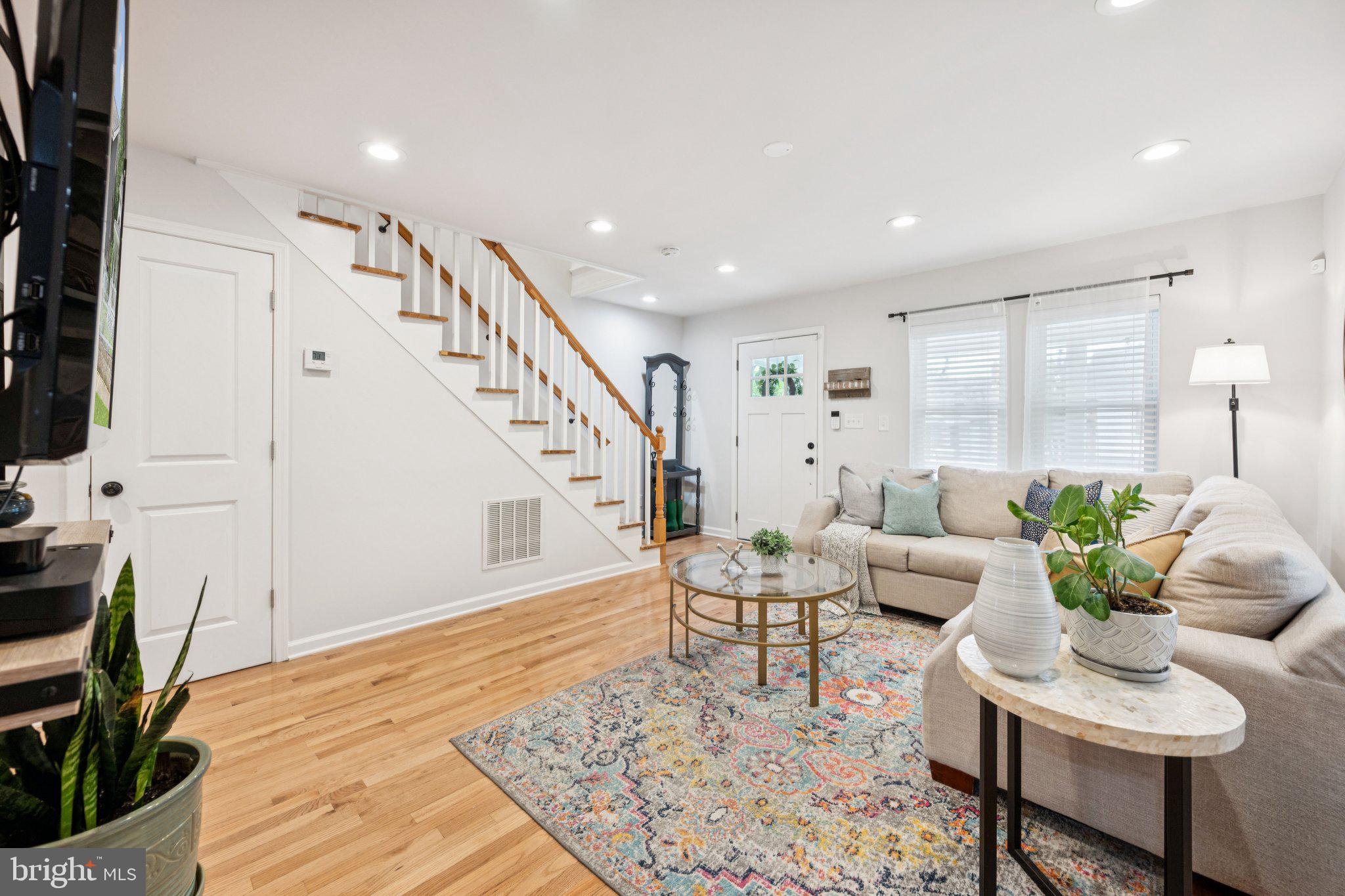 4014 37th Street Mount Rainier, MD 20712 - Photo 2 of 26 a living room with furniture and wooden floor