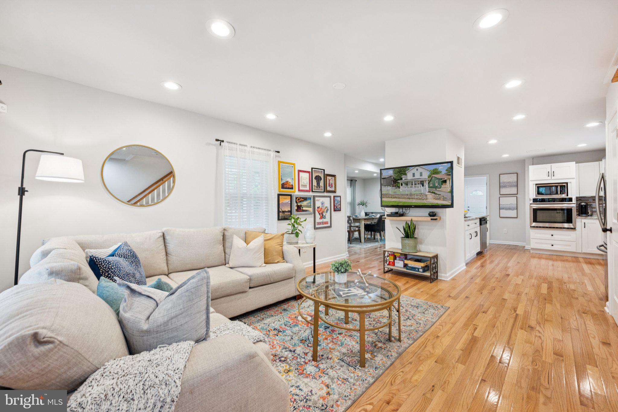 4014 37th Street Mount Rainier, MD 20712 - Photo 3 of 26 a living room with furniture and a wooden floor
