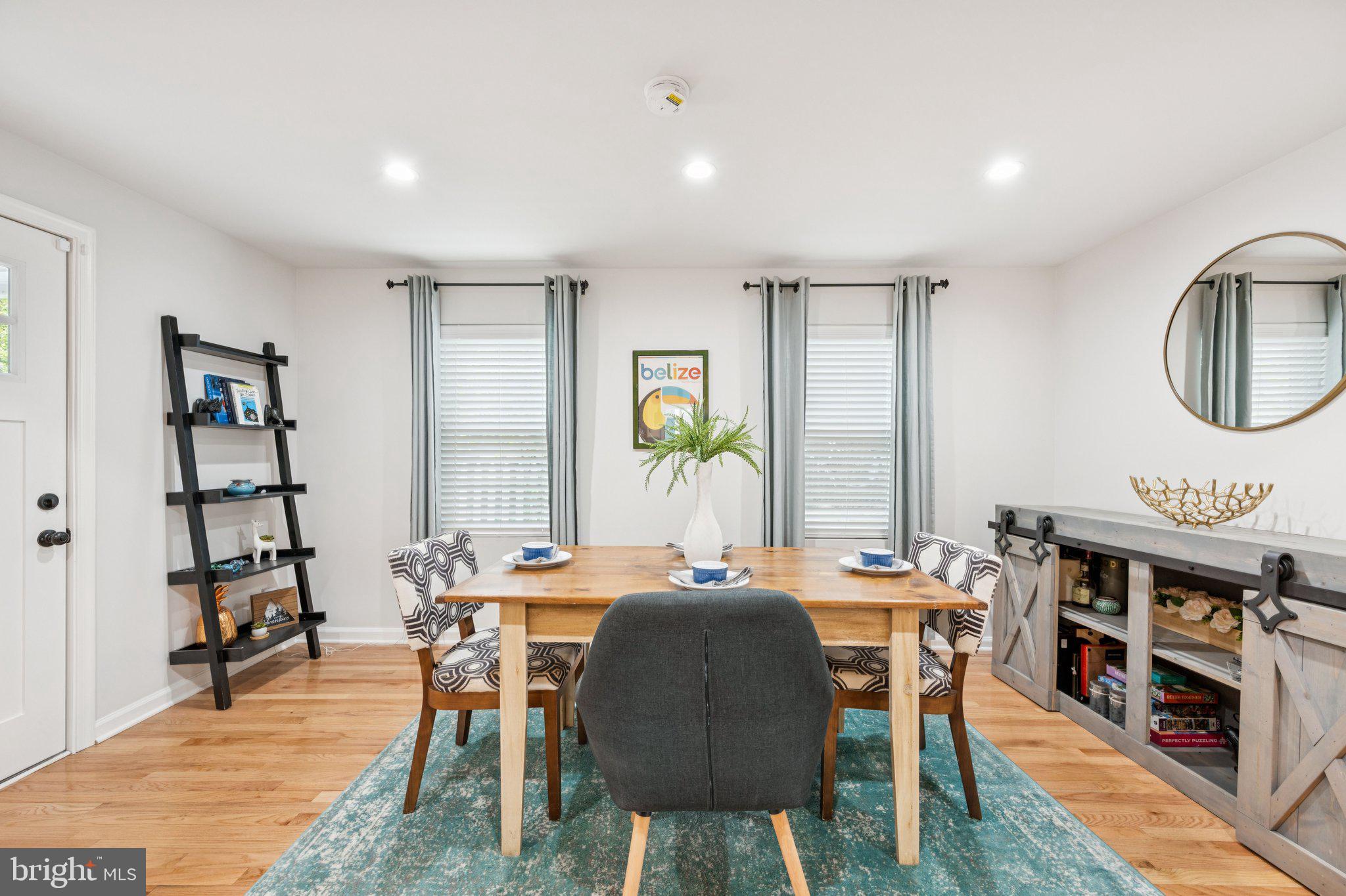 4014 37th Street Mount Rainier, MD 20712 - Photo 8 of 26 a view of a a dining room with furniture window and wooden floor