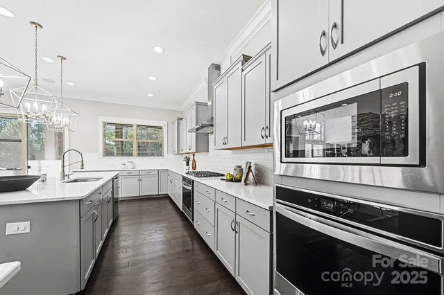 a kitchen with sink and stove