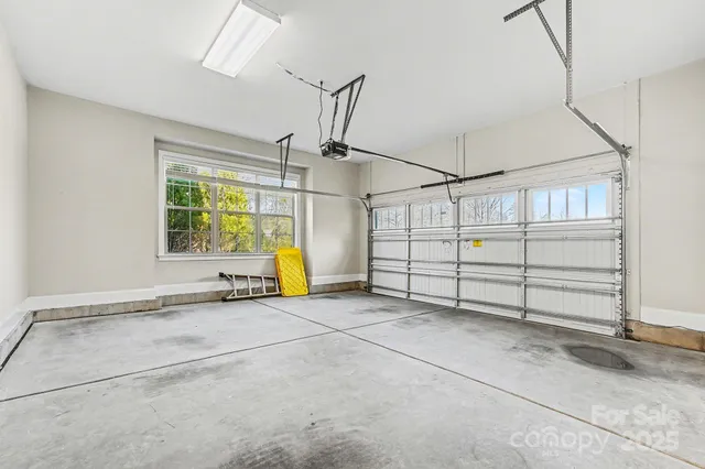 a view of a room with air conditioner duct and windows