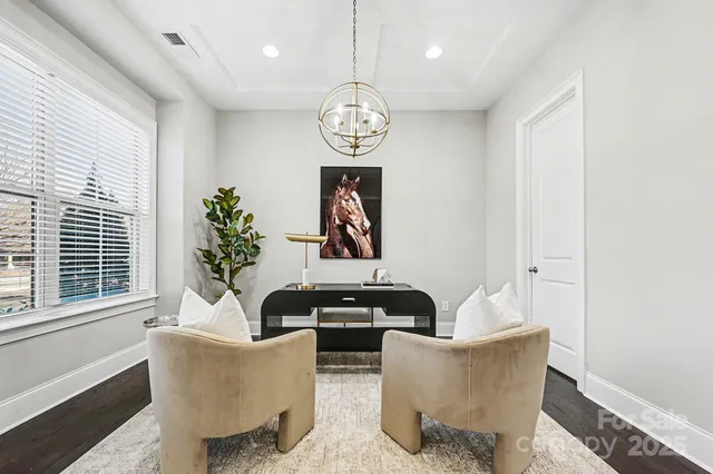 a living room with couches a table and chairs