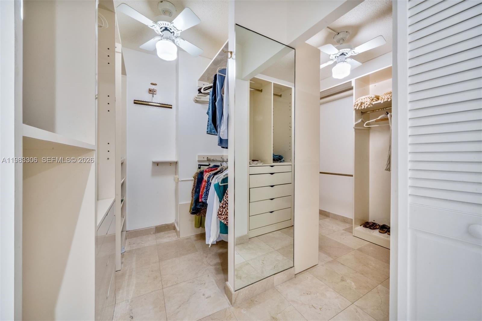 9801 Collins Avenue, Unit 19H Bal Harbour, FL 33154 - Photo 17 of 28 walk in closet with white walls
