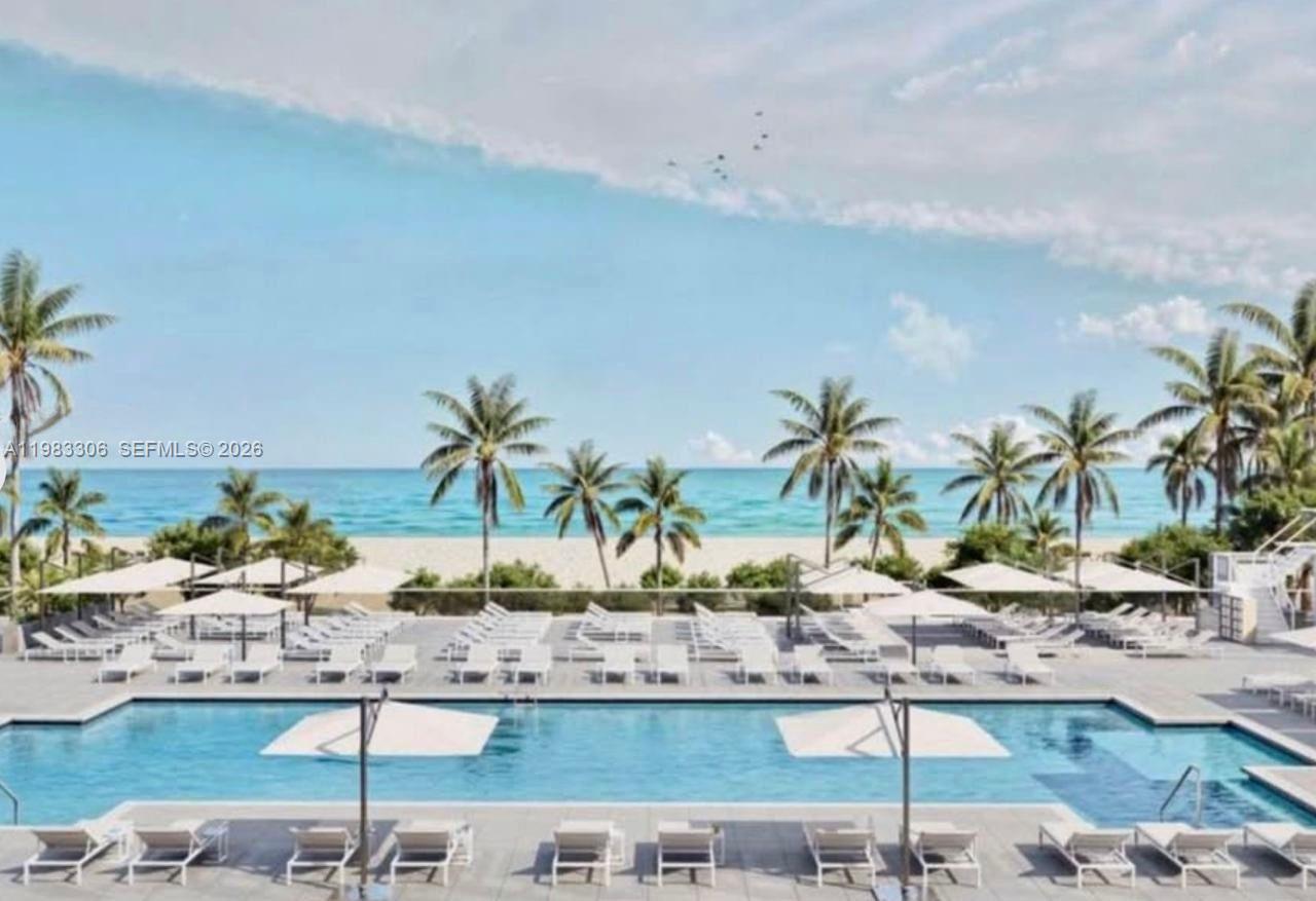 9801 Collins Avenue, Unit 19H Bal Harbour, FL 33154 - Photo 20 of 28 a view of ocean with a palm tree