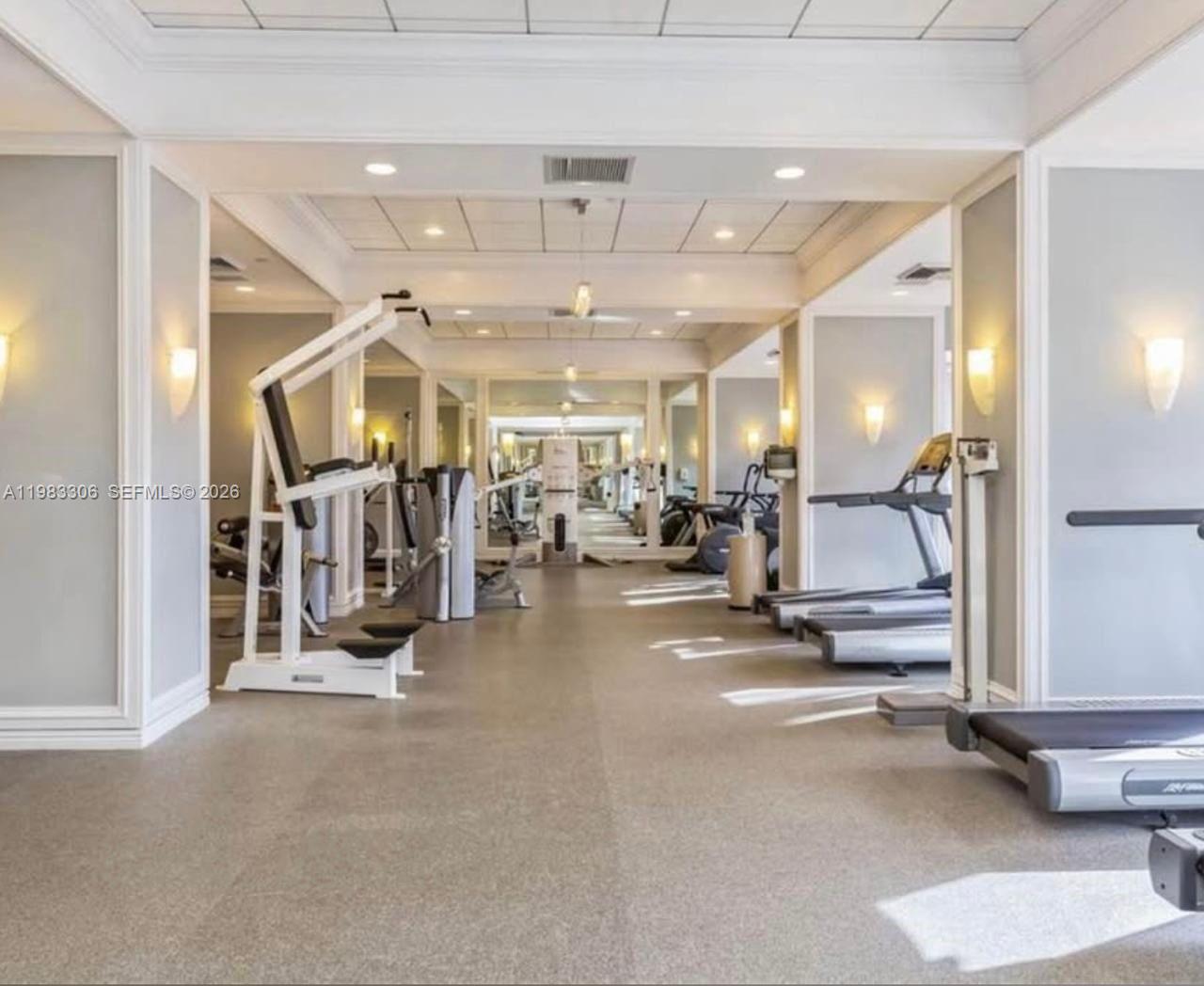 9801 Collins Avenue, Unit 19H Bal Harbour, FL 33154 - Photo 25 of 28 a view of a room with gym equipment