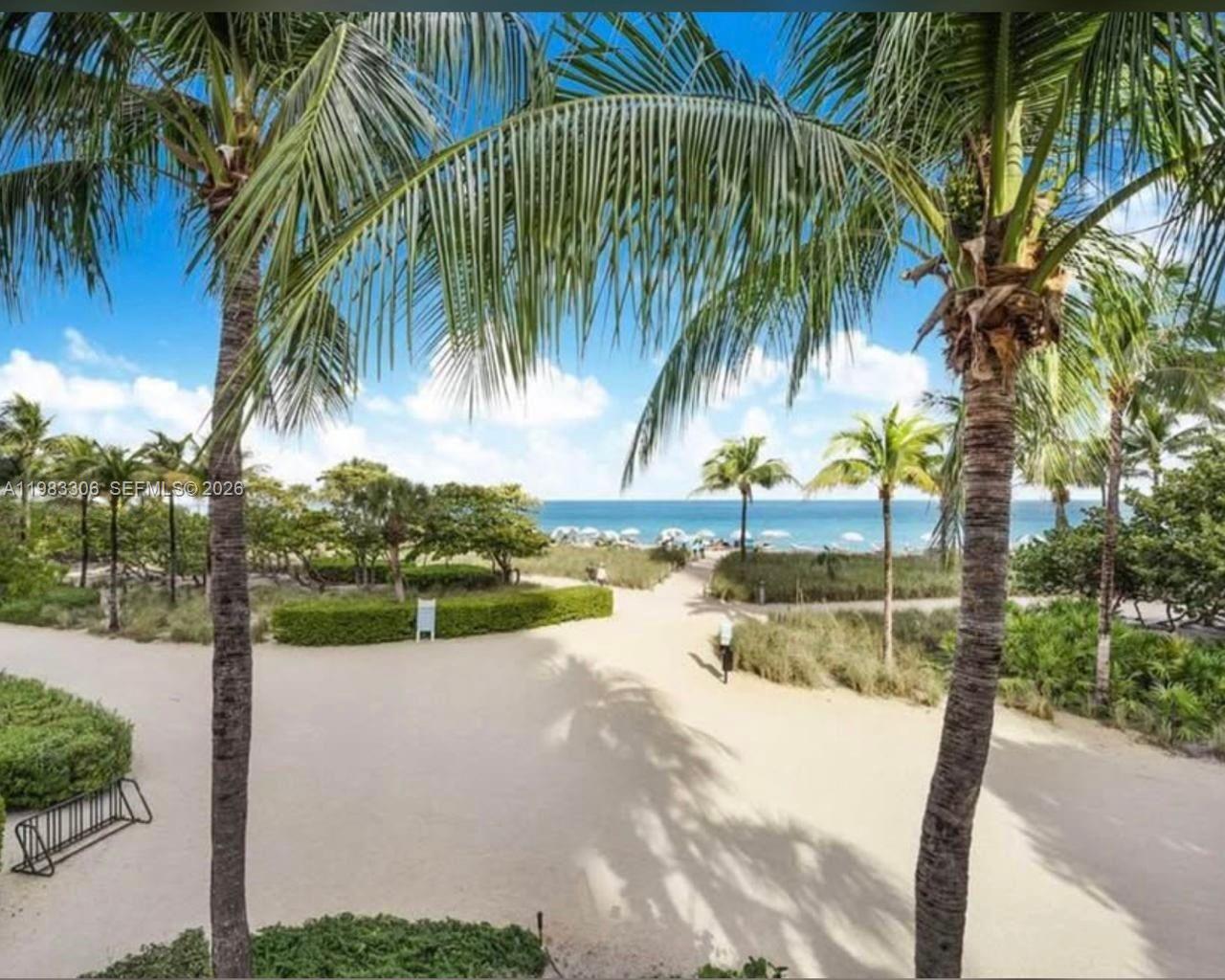 9801 Collins Avenue, Unit 19H Bal Harbour, FL 33154 - Photo 27 of 28 a view of a yard and palm trees