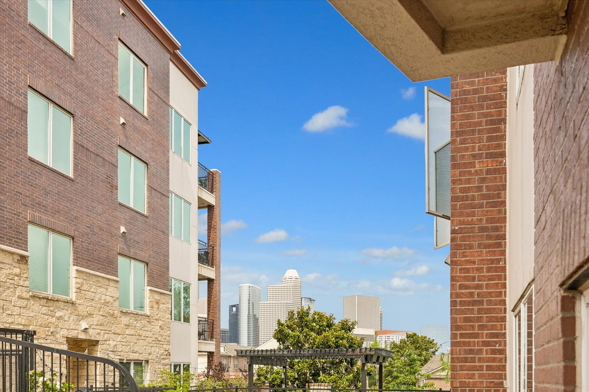 100 Willard Street, Unit 15 Houston, TX 77006 - Photo 6 of 25 Enjoy glimpses of the Downtown Houston skyline from the property, adding to the exceptional Midtown location and city lifestyle appeal.