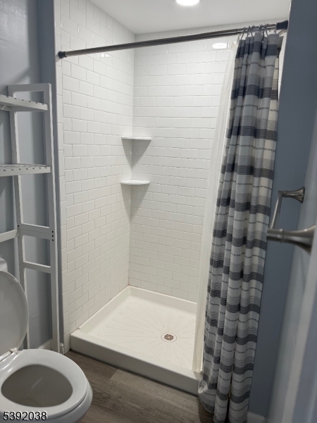 174 Main Street, Unit 2L Franklin, NJ 07416 - Photo 11 of 12 a bathroom with a bathtub and a shower