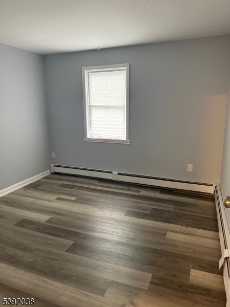 174 Main Street, Unit 2L Franklin, NJ 07416 - Photo 3 of 12 a view of a room with wooden floor and window