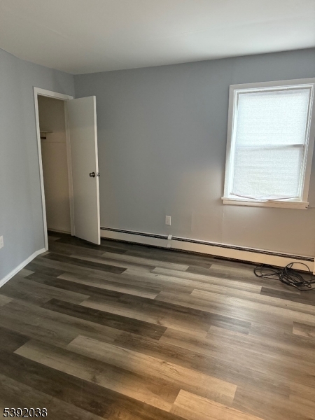 174 Main Street, Unit 2L Franklin, NJ 07416 - Photo 8 of 12 a view of a room with wooden floor and window