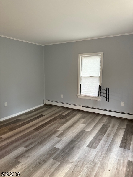 174 Main Street, Unit 2L Franklin, NJ 07416 - Photo 10 of 12 a view of a room with a wooden floor and a window