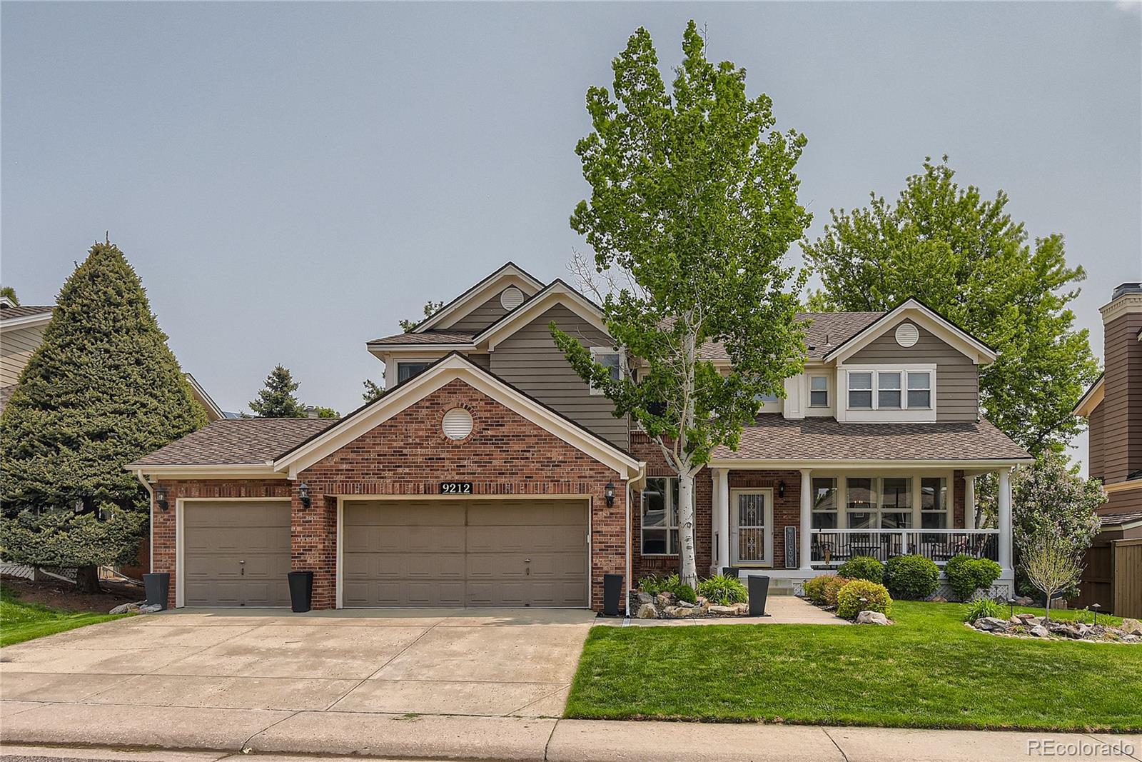 9212 Princeton Street Highlands Ranch, CO 80130 - Photo 1 of 40 front view of a house with a yard
