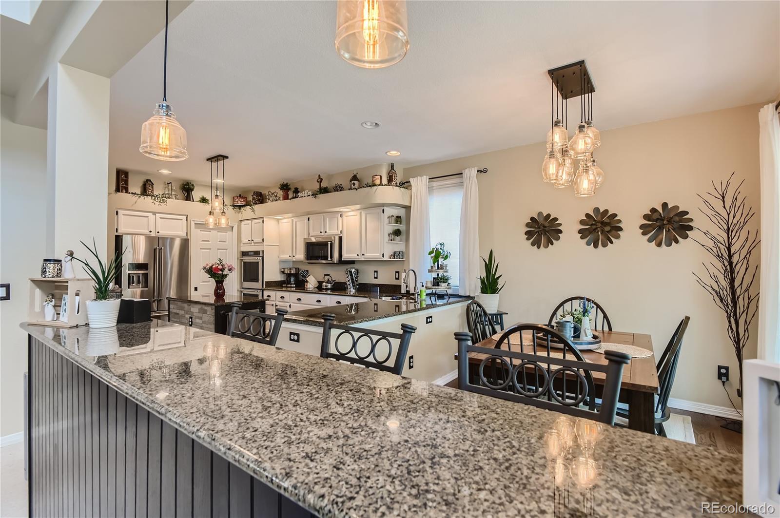 9212 Princeton Street Highlands Ranch, CO 80130 - Photo 13 of 40 a view of a dining room with furniture