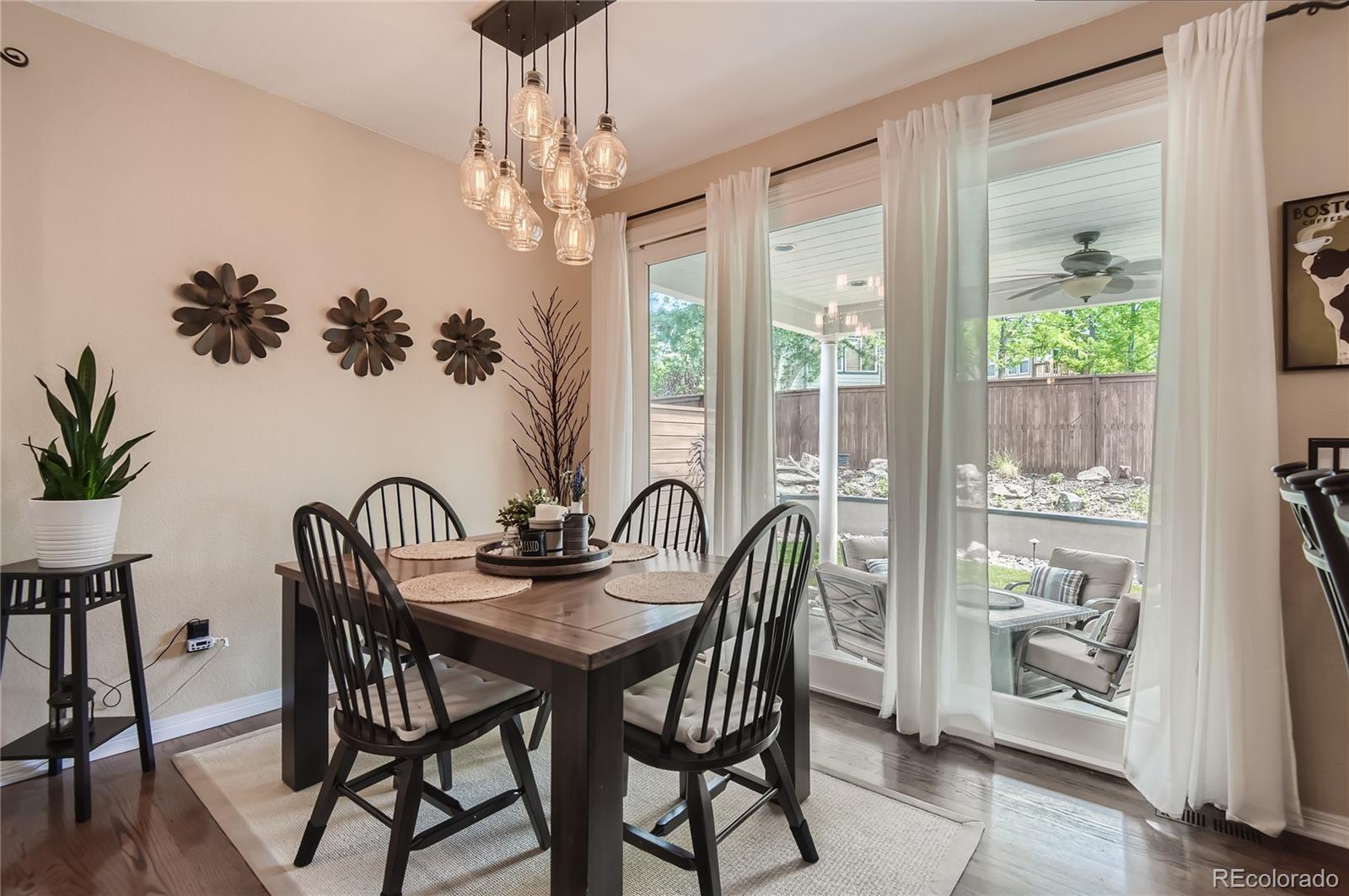 9212 Princeton Street Highlands Ranch, CO 80130 - Photo 15 of 40 a view of a dining room with furniture window and outside view