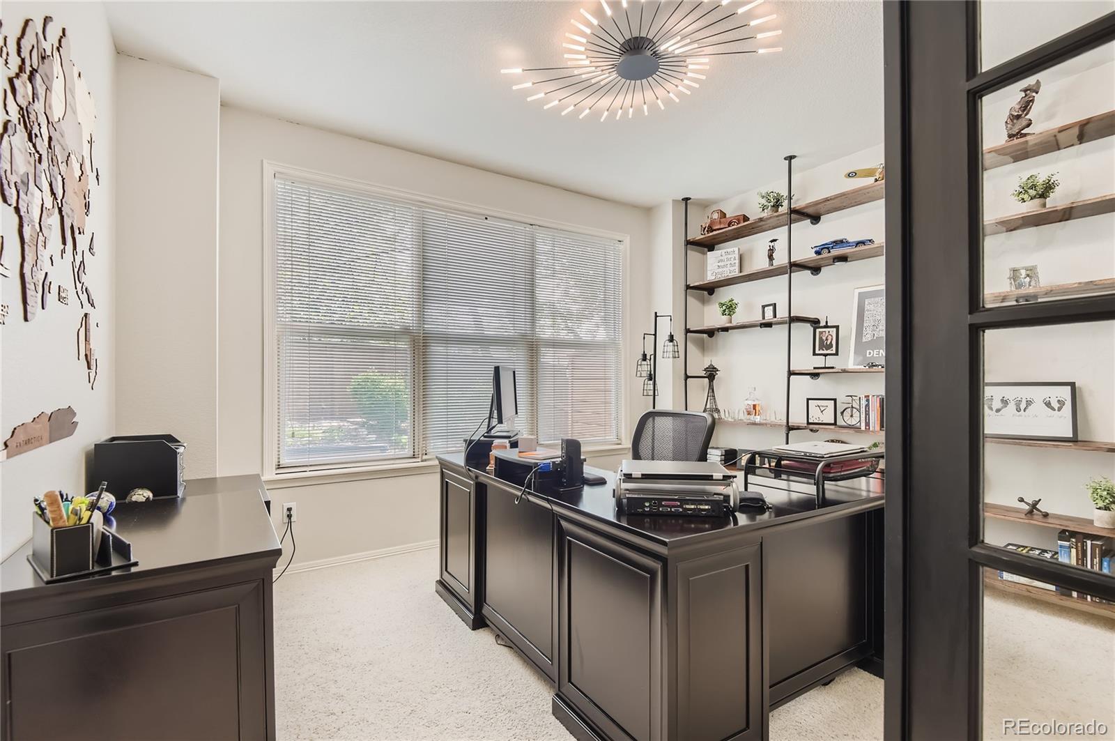 9212 Princeton Street Highlands Ranch, CO 80130 - Photo 16 of 40 a kitchen with a stove and a window