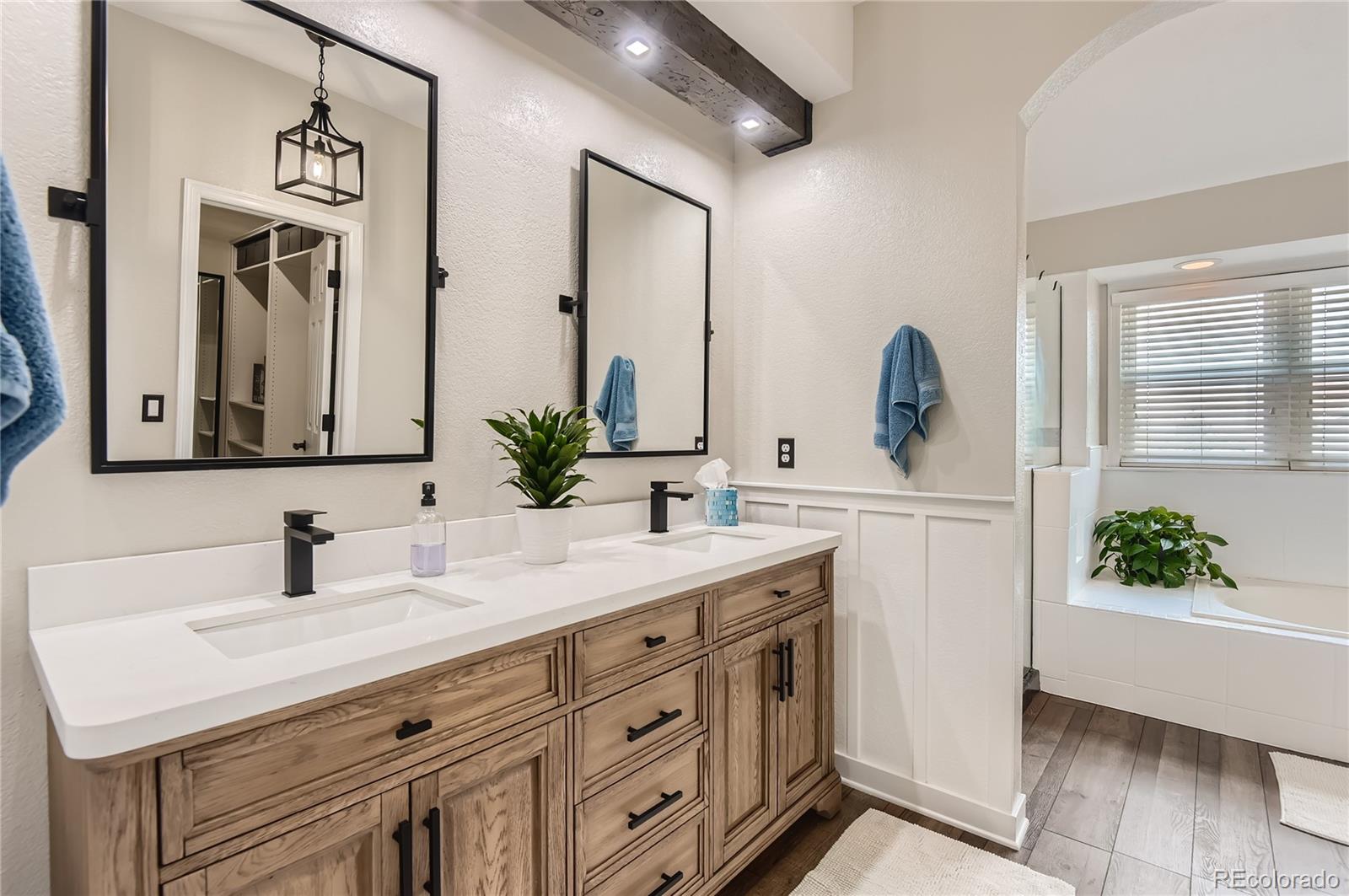 9212 Princeton Street Highlands Ranch, CO 80130 - Photo 21 of 40 a bathroom with a sink and a mirror