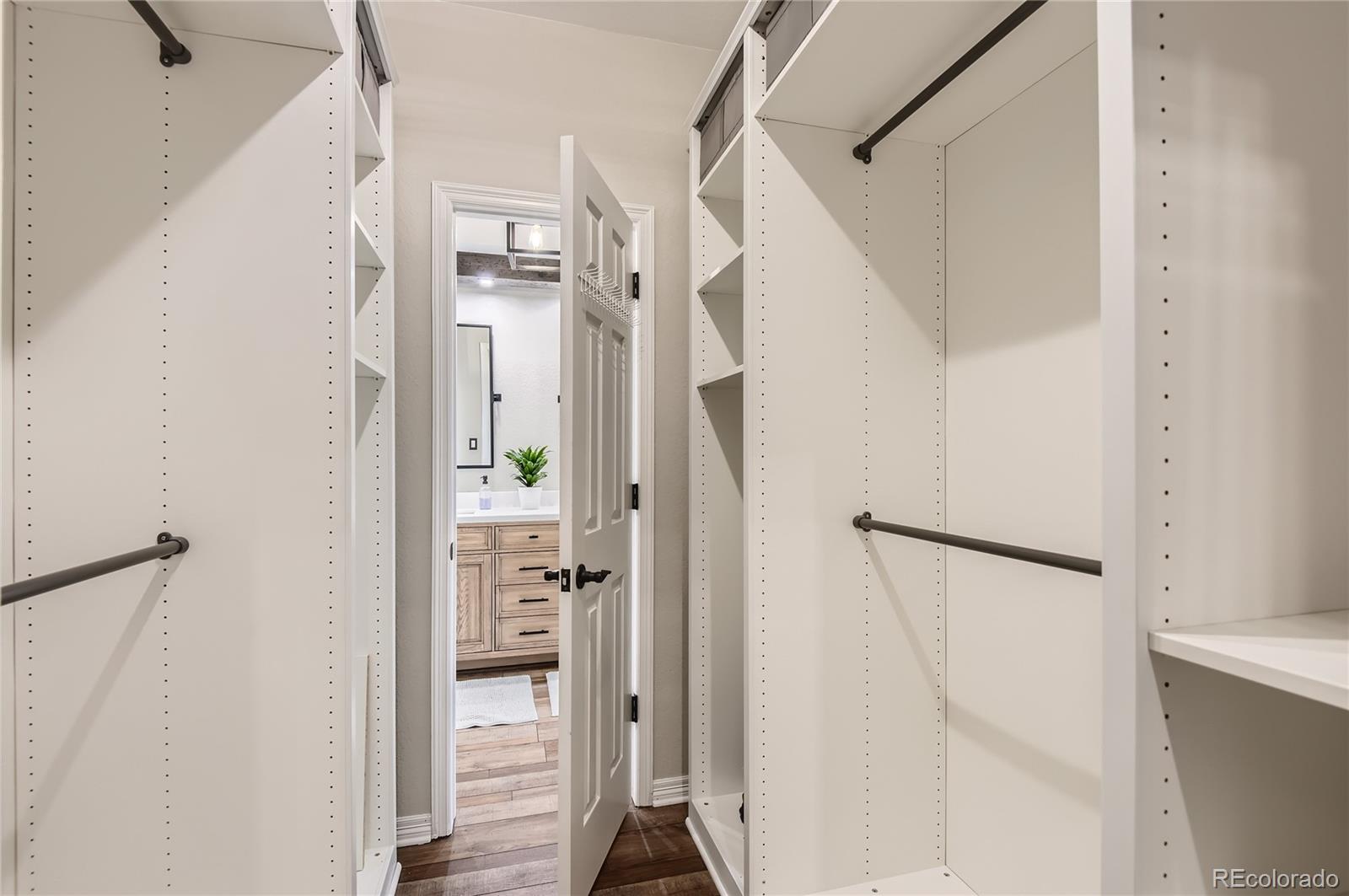 9212 Princeton Street Highlands Ranch, CO 80130 - Photo 25 of 40 a view of a hallway with wooden floor and entryway