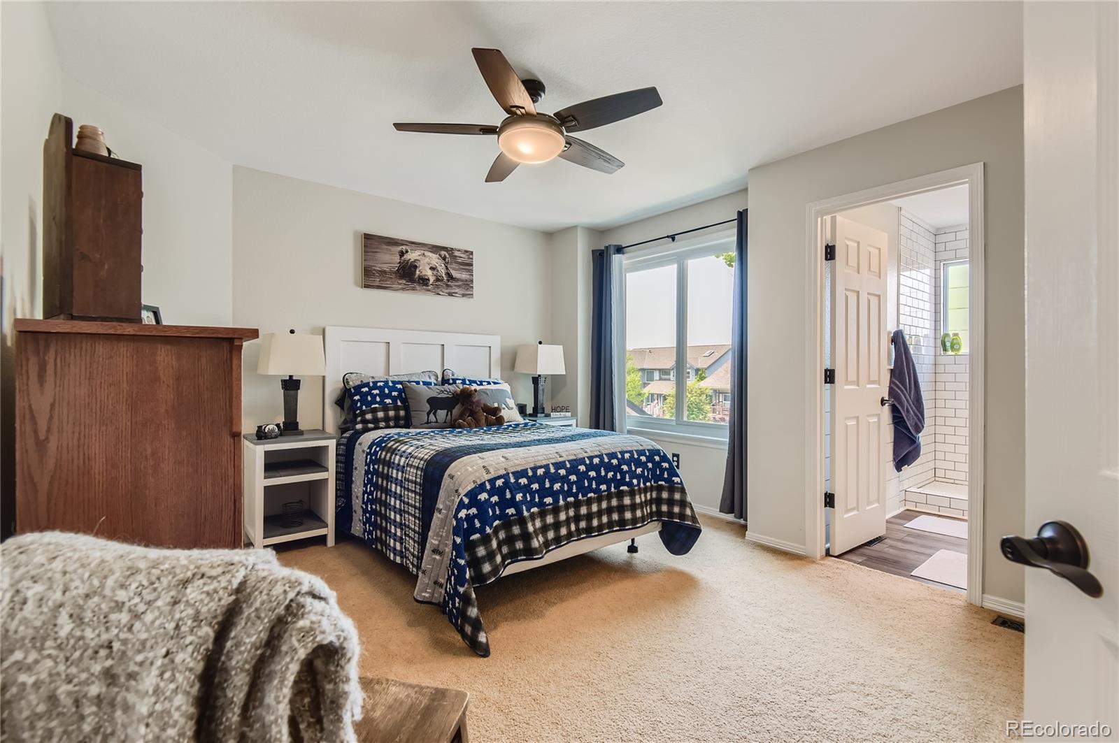 9212 Princeton Street Highlands Ranch, CO 80130 - Photo 26 of 40 a bedroom with a bed and a window with a potted plant