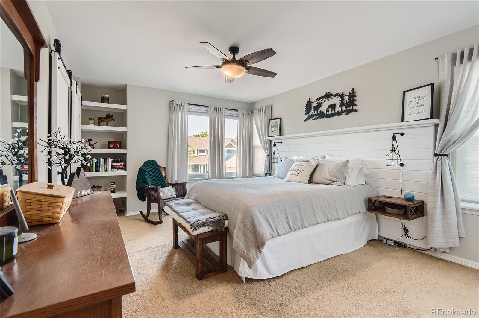 9212 Princeton Street Highlands Ranch, CO 80130 - Photo 30 of 40 a bedroom with a bed gym equipment and a large window
