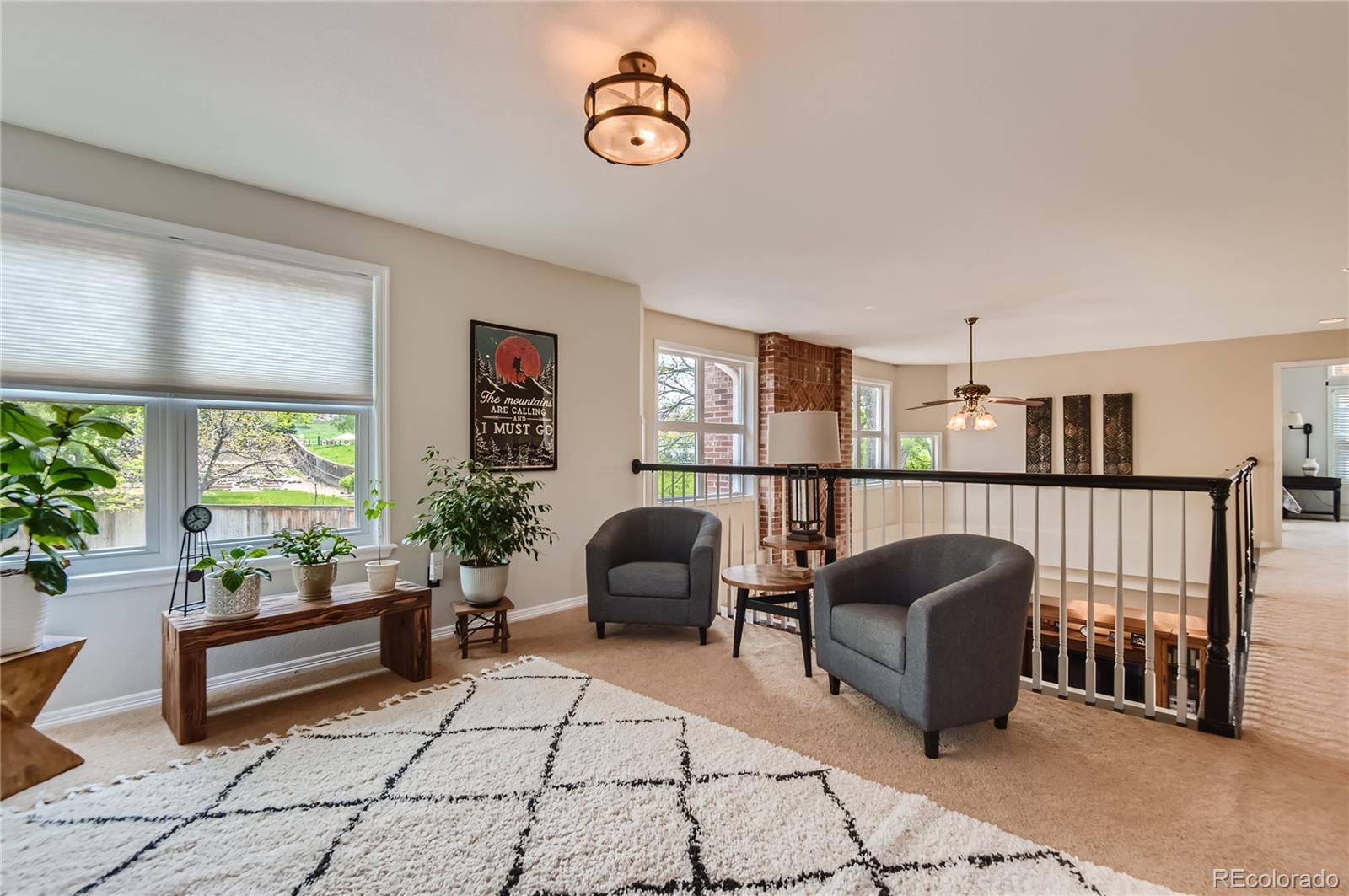 9212 Princeton Street Highlands Ranch, CO 80130 - Photo 32 of 40 a view of a workspace with furniture and a potted plant