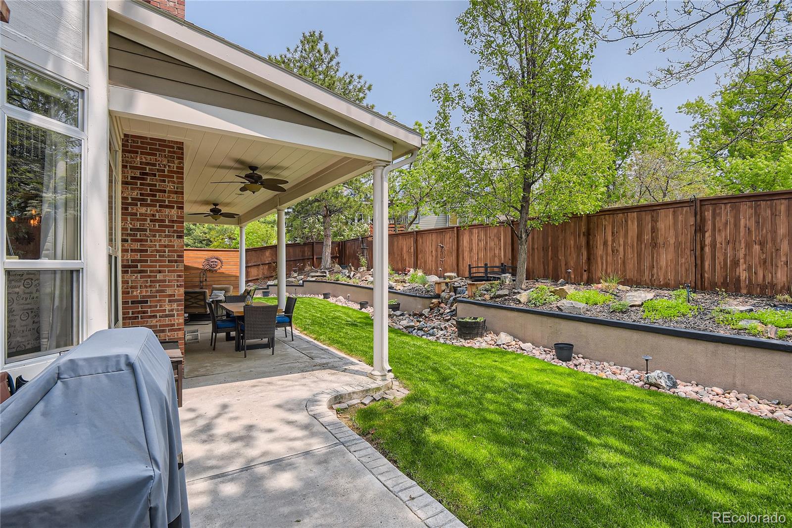 9212 Princeton Street Highlands Ranch, CO 80130 - Photo 39 of 40 a view of backyard with outdoor seating and plants