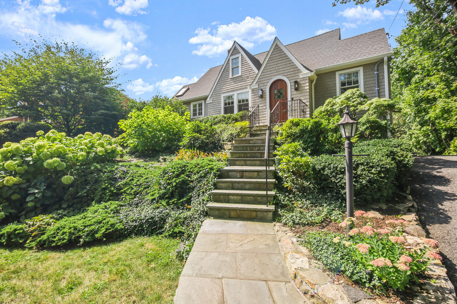 a front view of a house with a yard