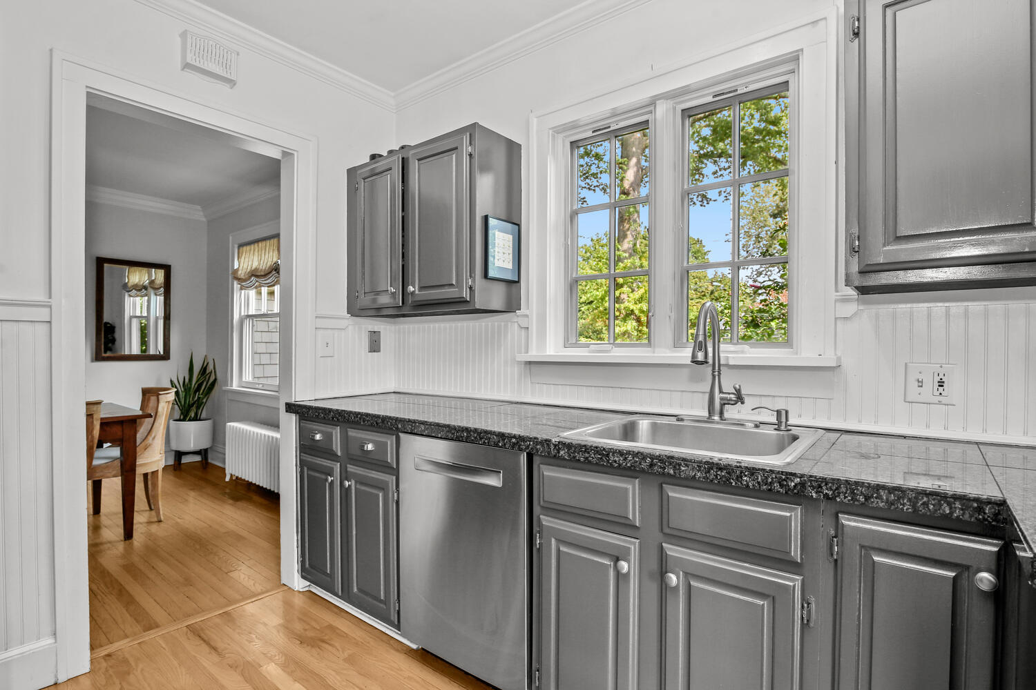 25 Butler Street Greenwich, CT 06807 - Photo 12 of 37 a kitchen with stainless steel appliances granite countertop a sink stove and cabinets